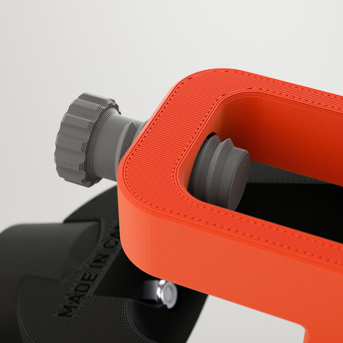Close-up of the GTX Elite curling head showing screw mechanism for setting custom turns on the stone.
